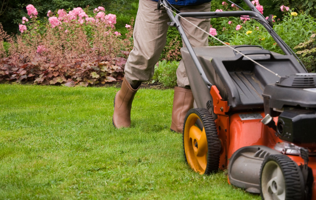landscaper mowing the lawn