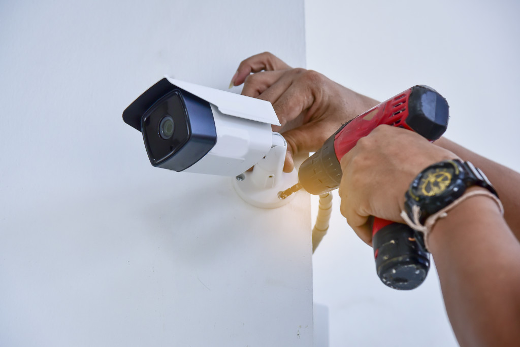 installing a security camera on a corner of a building