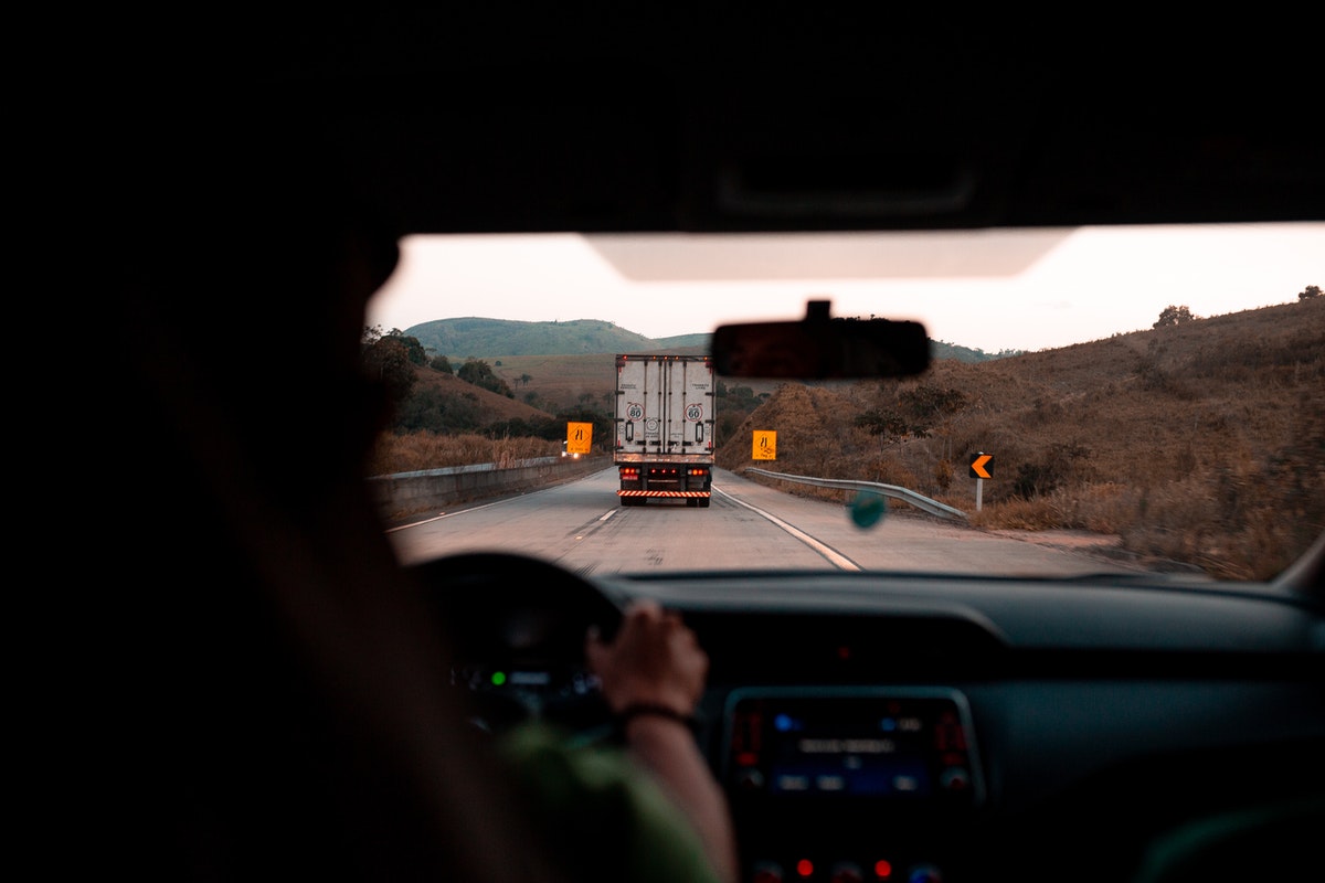 person driving on a road